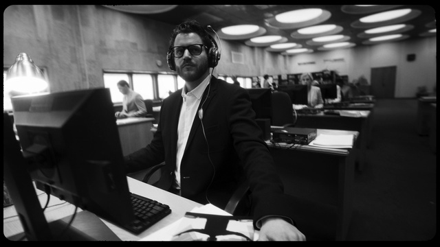 Video Reference: Sunglasses, Vision care, Computer, Goggles, Personal computer, Coat, Laptop, Automotive design, Standing, Black-and-white