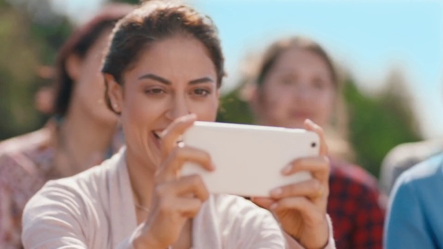 Video Reference: Hand, Eyelash, Mobile phone, Happy, Sky, Gesture, Finger, Communication Device, Leisure, Street fashion