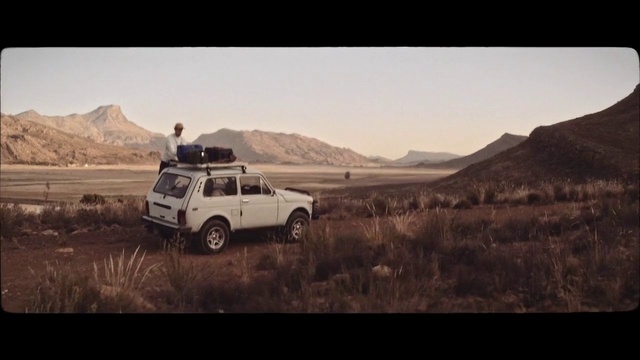 Video Reference: Tire, Wheel, Plant, Vehicle, Mountain, Car, Automotive tire, Automotive carrying rack, Sky, Automotive design