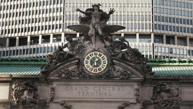 Video Reference: Building, Daytime, Light, World, Sculpture, Clock, Public space, City, Font, Facade