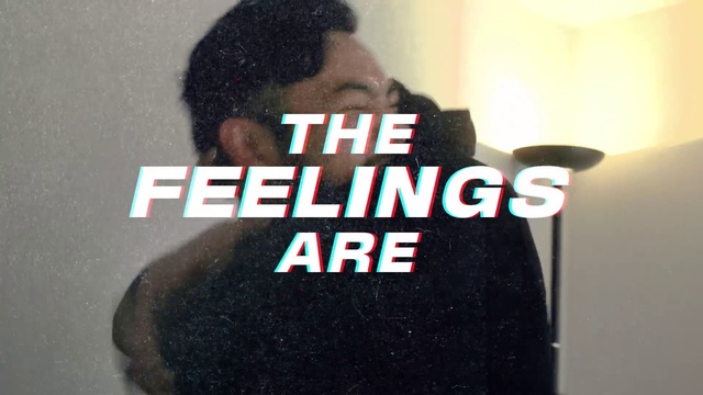 Video Reference: Neck, Sleeve, T-shirt, Black hair, Font, Facial hair, Eyewear, Electric blue, Graphics, Logo