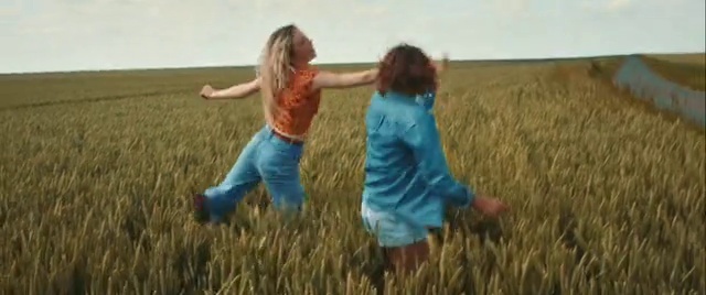 Video Reference: Plant, People in nature, Happy, Standing, Natural landscape, Gesture, Sky, Grass, Grassland, Plain