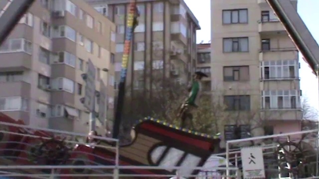 Video Reference: Building, Window, Tower block, Urban design, Condominium, Sky, Neighbourhood, Residential area, Real estate, Facade