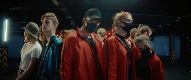 Video Reference: Hat, Sleeve, Headgear, Jacket, Entertainment, T-shirt, Event, Performing arts, Cap, Team