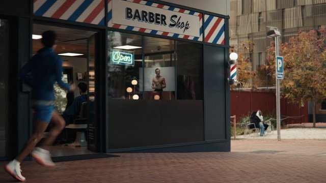 Video Reference: barber shop, storefront, street, runner, motion blur, neon sign, window, urban, sidewalk, outdoor, pedestrian, city, barbershop, interior, exterior