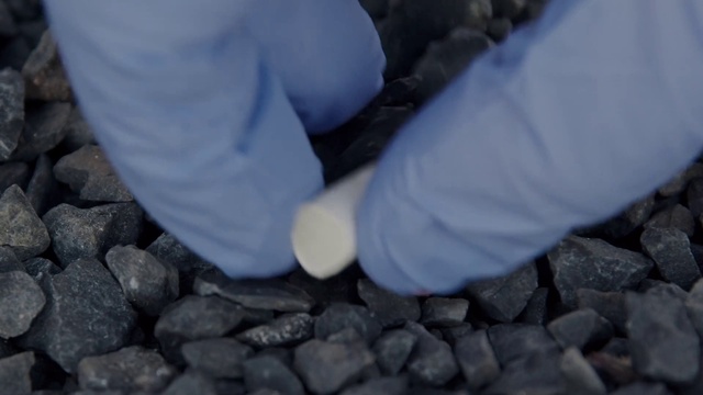 Video Reference: Hand, Gesture, Bedrock, Flooring, Geological phenomenon, Electric blue, Wood, Human leg, Automotive tire, Landscape