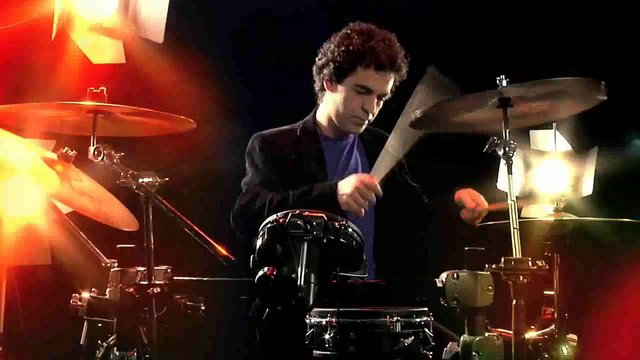 Video Reference: drummer, drum kit, music, performance, stage, concert, percussion, musician, spotlight, live show, lights, blurry motion
