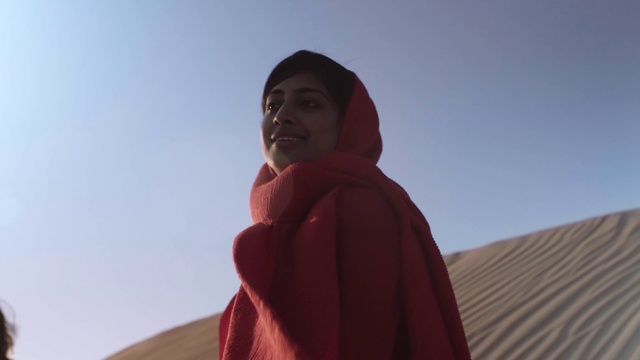 Video Reference: Sky, Sleeve, Jacket, Landscape, Happy, Electric blue, Shawl, Travel, Magenta, Hoodie