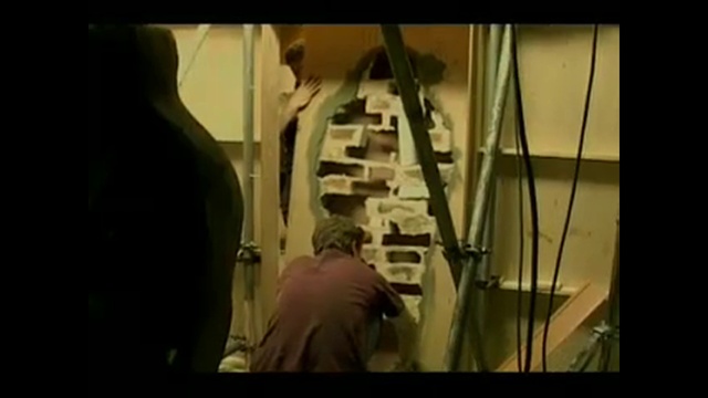 Video Reference: Event, Font, Art, Darkness, Glass, Visual arts, Room, Display device, Metal, Ladder