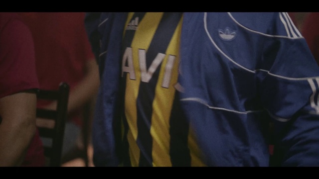 Video Reference: Jersey, Sports jersey, Sleeve, Gesture, Sports uniform, Sportswear, Flag, Font, Electric blue, T-shirt