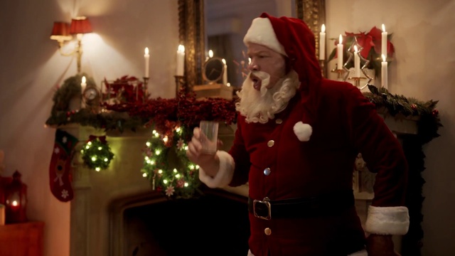 Video Reference: Candle, Lighting, Beard, Sleeve, Christmas decoration, Holiday, Facial hair, Christmas, Event, Candle holder