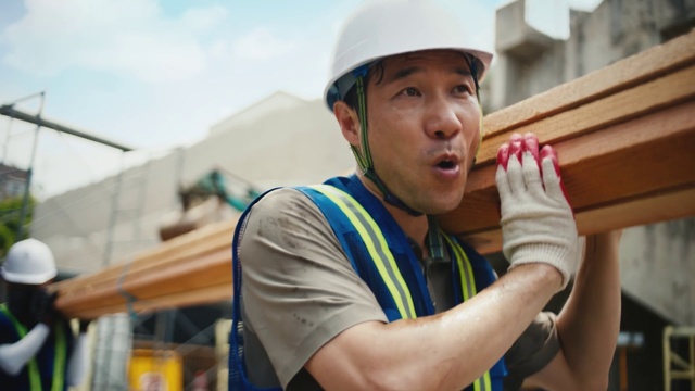 Video Reference: Hard hat, Sky, Helmet, Gesture, Workwear, Headgear, Vest, Engineer, Cloud, Personal protective equipment