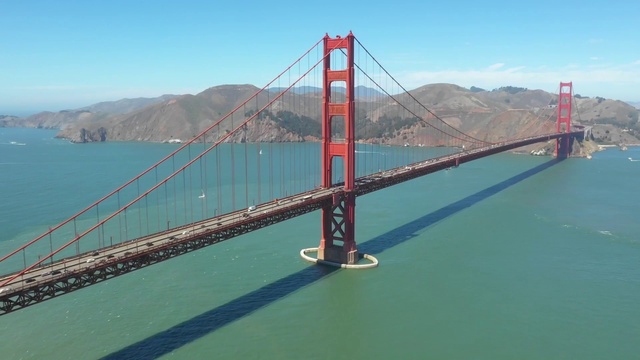 Video Reference: Water, Sky, Mountain, Cloud, Bridge, Lake, Road, Suspension bridge, Headland, Cable-stayed bridge