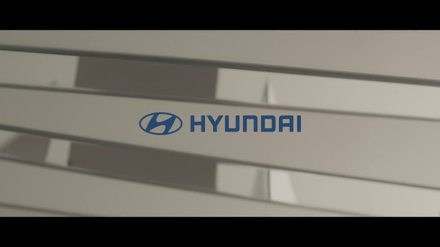 Video Reference: Rectangle, Automotive design, Font, Parallel, Automotive exterior, Electric blue, Triangle, Signage, Brand, Composite material