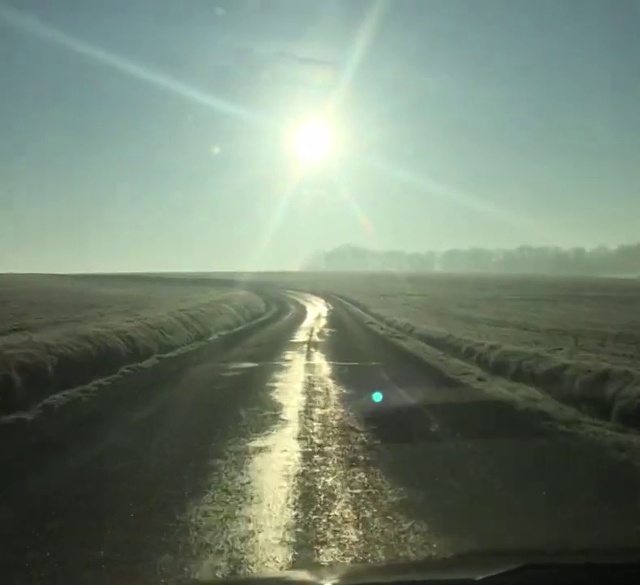 Video Reference: Sky, Atmosphere, Ecoregion, Road surface, Natural landscape, Asphalt, Sunlight, Mode of transport, Horizon, Atmospheric phenomenon
