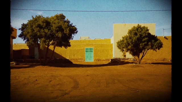 Video Reference: Sky, Plant, Building, Tree, Road surface, Shade, Window, Grass, Tints and shades, Road