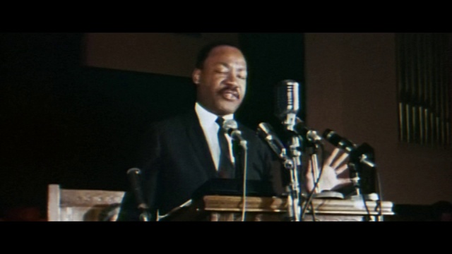 Video Reference: Musician, Microphone, Music, Music artist, Audio equipment, Entertainment, Microphone stand, Spokesperson, Performing arts, Suit