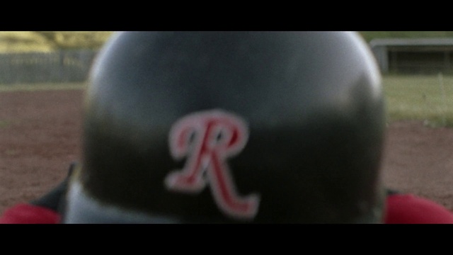 Video Reference: Head, Human body, Gesture, Sports equipment, Asphalt, Tree, Personal protective equipment, Auto part, Font, Recreation