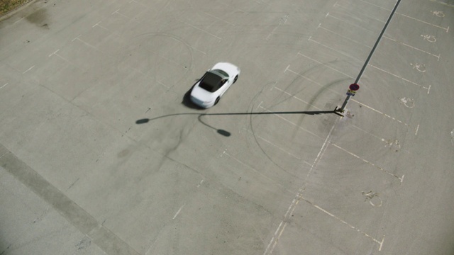 Video Reference: Automotive tire, Vehicle, Car, Road surface, Asphalt, Automotive lighting, Motor vehicle, Vehicle door, Line, Floor