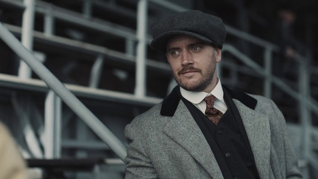 Video Reference: Clothing, Outerwear, Beard, Dress shirt, Flash photography, Sleeve, Collar, Cap, Hat, Tie