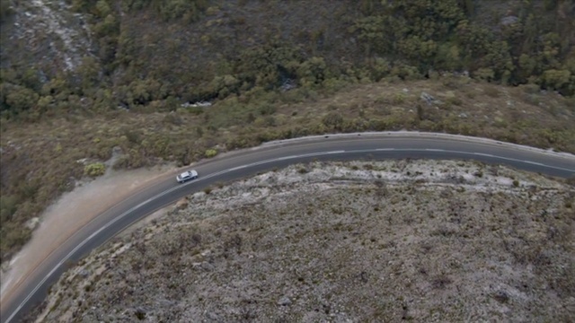 Video Reference: Plant community, Automotive tire, Plant, Asphalt, Road surface, Vehicle, Slope, Grass, Thoroughfare, Road