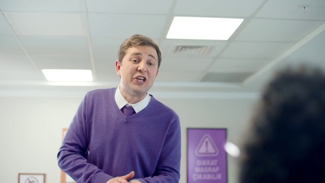 Video Reference: Sleeve, Purple, Gesture, White-collar worker, Event, Job, Design, Magenta, Public speaking, Fun