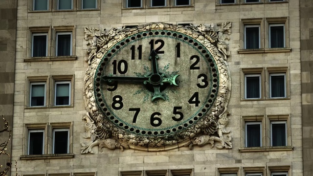 Video Reference: Window, Daytime, Photograph, Building, Watch, Clock, Quartz clock, Font, Material property, Clock tower