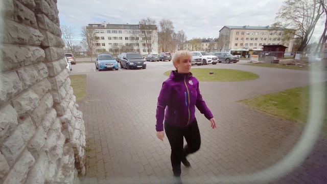 Video Reference: Plant, Sky, Car, Road surface, Infrastructure, Asphalt, Tree, Standing, Street fashion, Sidewalk