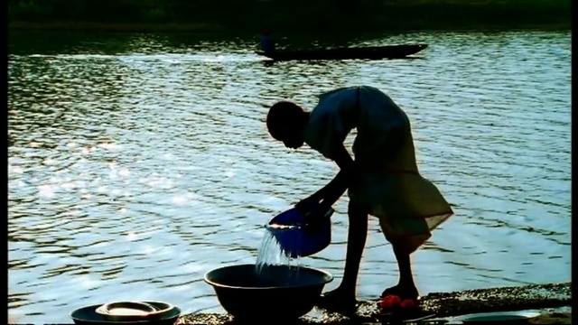 Video Reference: Water, People in nature, Lake, Leisure, Cooking, Recreation, Cookware and bakeware, Bucket, Sitting, Reflection