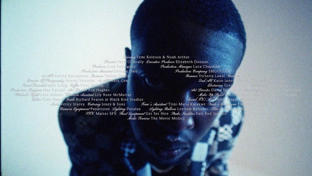 Video Reference: Jaw, Eyelash, Cap, Font, Electric blue, Personal protective equipment, Knit cap, Woolen, Fashion accessory, Wig