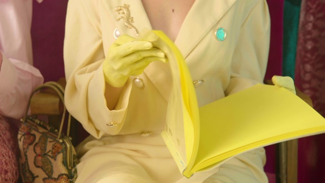 Video Reference: Dress, Neck, Sleeve, Yellow, Comfort, Collar, Human leg, Fashion design, Formal wear, Linens