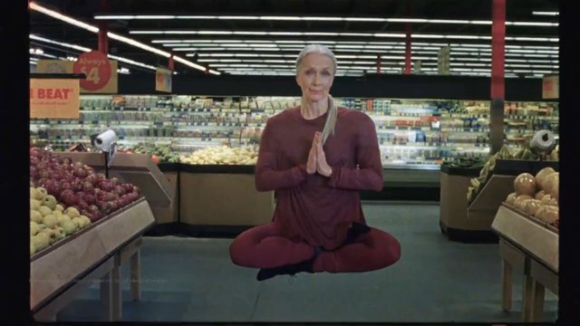 Video Reference: supermarket, grocery store, produce aisle, meditation, floating, cross-legged, person, indoor, fruits, vegetables, retail, surreal, wellness, aisle, shopping, flyer
