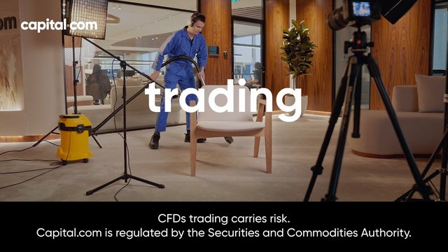 Video Reference: office, studio, vacuuming, man, coveralls, lighting, camera tripod, chairs, potted plant, interior, advertisement, trading, finance, cleaning, set, disclaimer