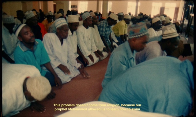 Video Reference: Shirt, Event, T-shirt, Turban, Service, Job, Room, Ceremony, Religious institute, Crowd