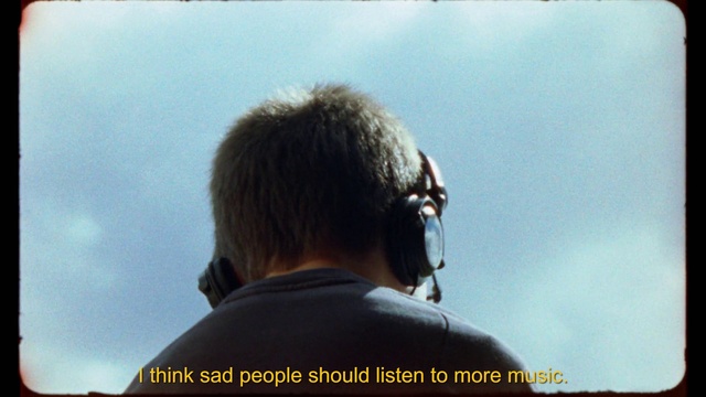 Video Reference: Outerwear, Sky, People in nature, Audio equipment, Travel, Happy, Facial hair, Flash photography, Grass, Landscape