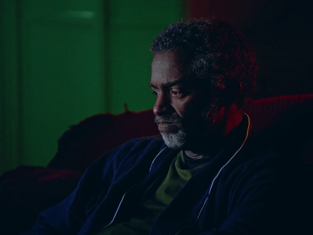 Video Reference: Beard, Flash photography, Facial hair, Audio equipment, Eyewear, Couch, Event, Moustache, Darkness, T-shirt