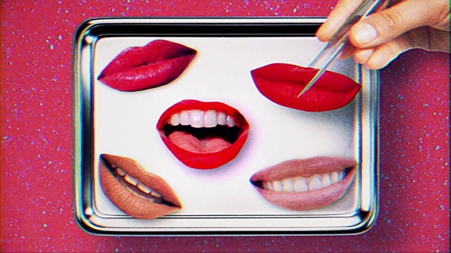 Video Reference: Lip, Lipstick, Mouth, Eye, Eyelash, Tooth, Human body, Jaw, Orange, Gesture