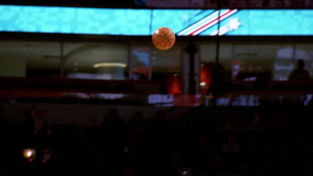 Video Reference: Basketball, Sports equipment, Ball, Field house, Basketball court, City, Event, Basketball hoop, Sport venue, Display device