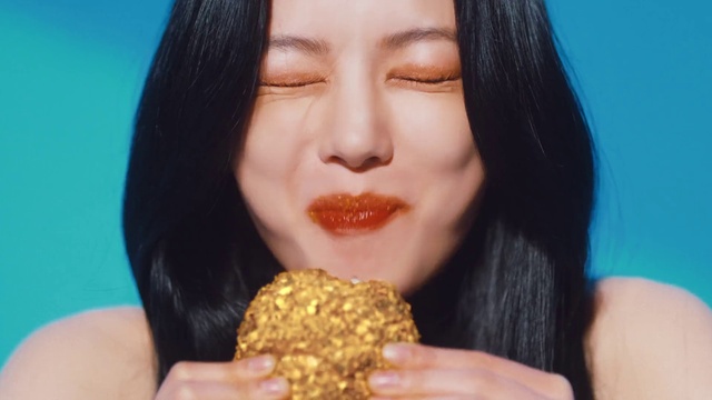 Video Reference: Nose, Food, Lip, Eyelash, Jaw, Yellow, Gesture, Food craving, Finger, Happy