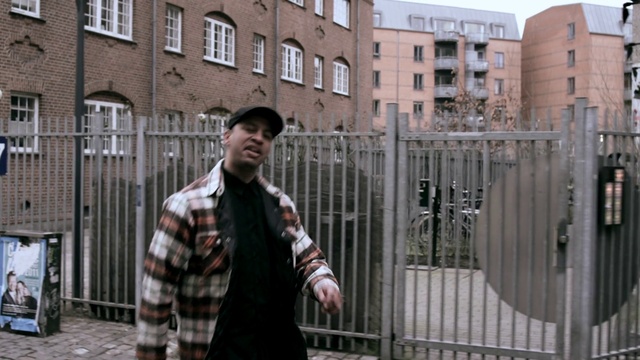 Video Reference: Building, Tartan, Window, Sky, Fence, Sleeve, Dress shirt, Street fashion, Plaid, Travel
