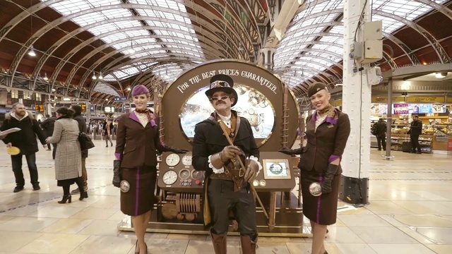 Video Reference: Footwear, Trousers, Smile, Automotive design, Luggage and bags, Travel, Suit, Street fashion, City, Bag