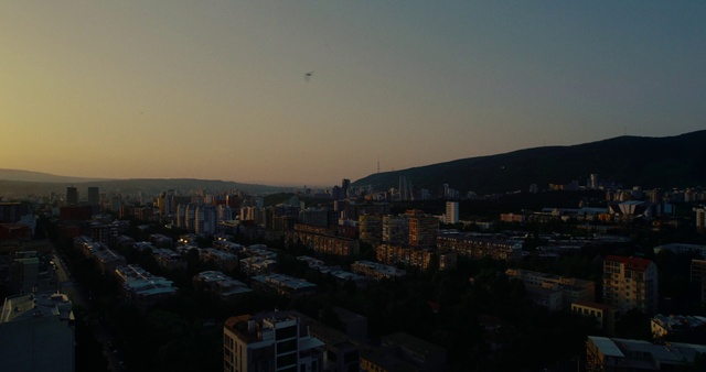 Video Reference: Sky, Atmosphere, Building, Tower block, Architecture, Sunlight, Dusk, Urban design, Landscape, Cityscape