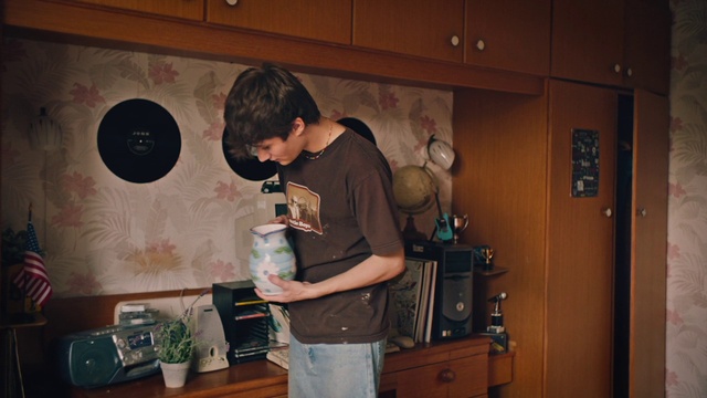 Video Reference: Cabinetry, Wood, T-shirt, Event, Kitchen appliance, Drawer, Hardwood, Tableware, Fun, Cupboard