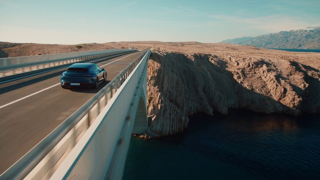 Video Reference: Sky, Water, Car, Azure, Infrastructure, Vehicle, Road surface, Asphalt, Cloud, Landscape