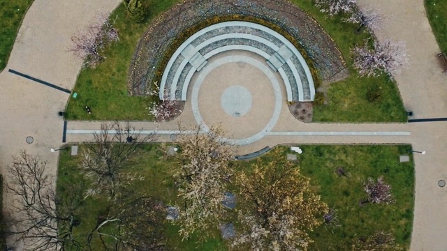 Video Reference: Plant, Urban design, Tree, Vegetation, Building, Grass, Automotive tire, Landscape, Facade, Circle