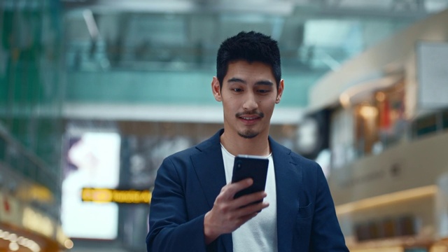 Video Reference: Outerwear, Dress shirt, Coat, Street fashion, Gesture, Collar, Beard, Audio equipment, Blazer, Happy