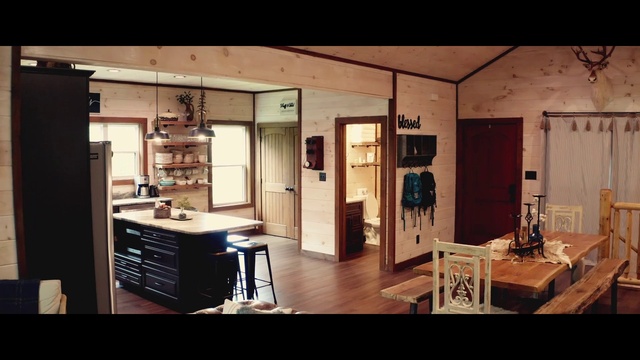 Video Reference: Table, Property, Cabinetry, Picture frame, Wood, Desk, Lighting, Shelving, Interior design, Building