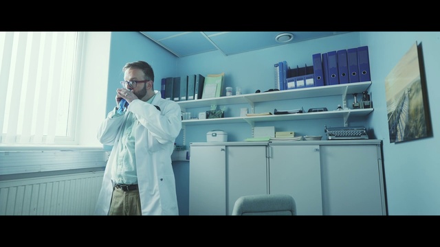 Video Reference: Dress shirt, Sleeve, Service, Flash photography, Electric blue, White-collar worker, Room, Shelving, Shelf, Machine