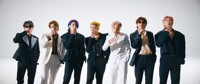 Video Reference: Suit trousers, Trousers, Sleeve, Coat, Gesture, Hat, Suit, Fashion design, Blazer, Formal wear