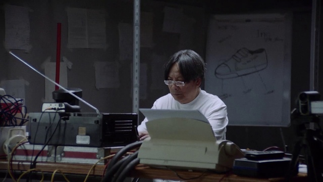 Video Reference: Office equipment, Eyewear, Audio equipment, Office supplies, Electronic device, Desk, Input device, Job, Event, Sitting